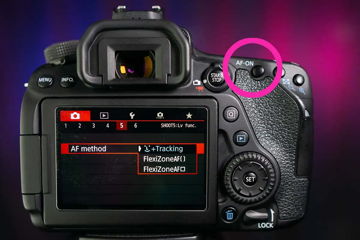 back of a camera with a pink circle denoting back button focus AF-ON canon camera