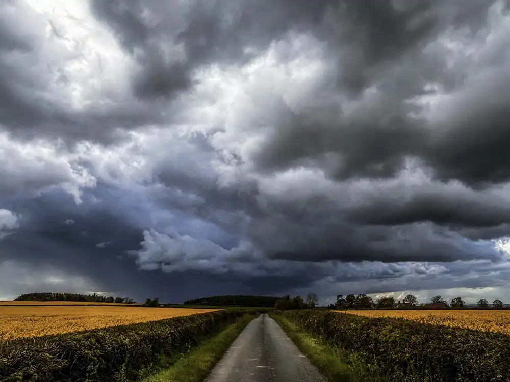 Country road under a stormy sky