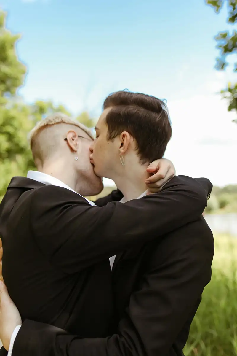 a same sex couple cuddling and holding each other