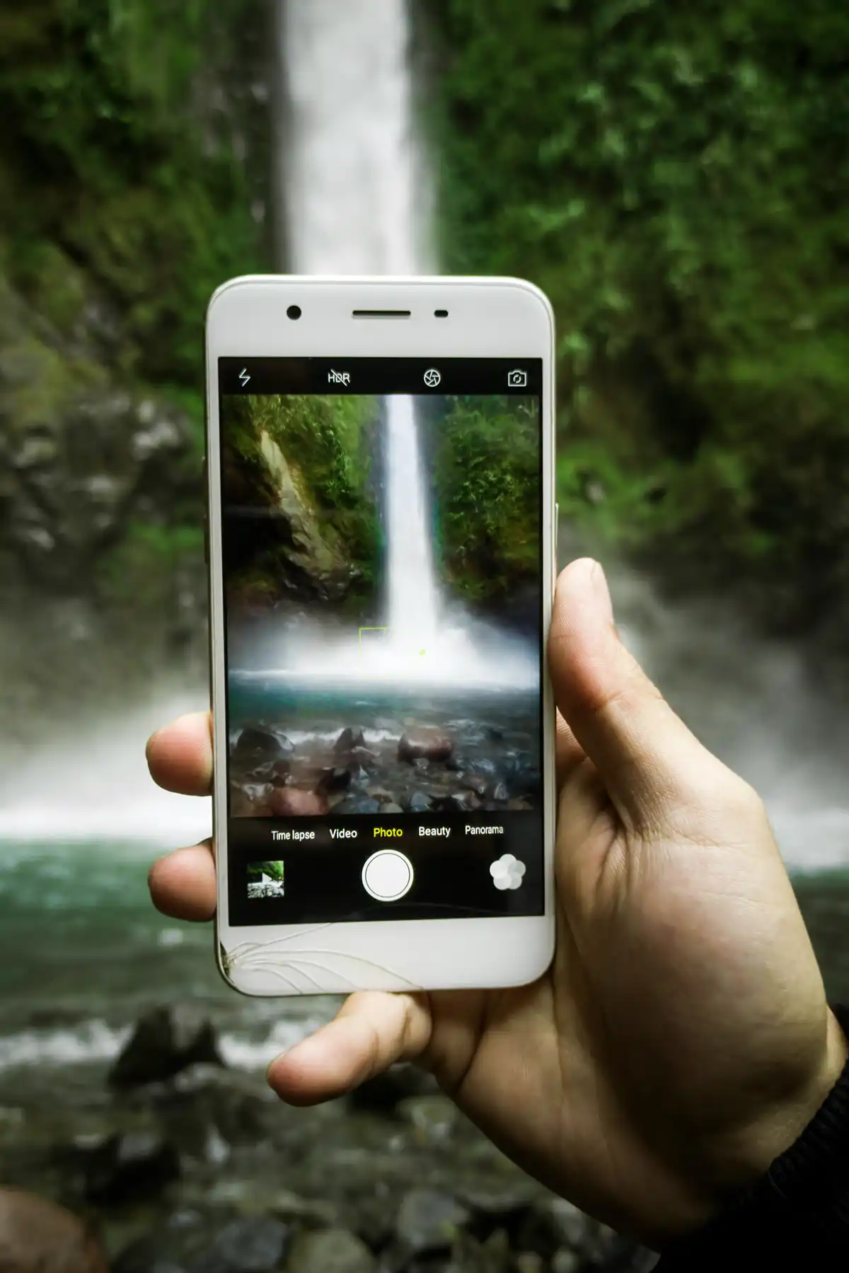 iPhone camera taking a photo of waterfall