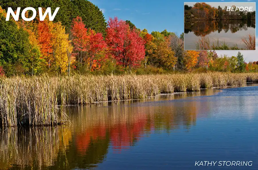 a river in autumn with red orange and yellow trees