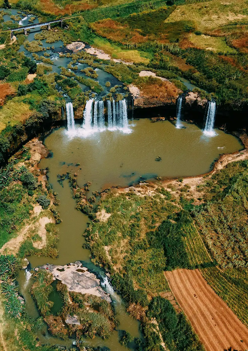 Looking down at a waterfall and splashpool