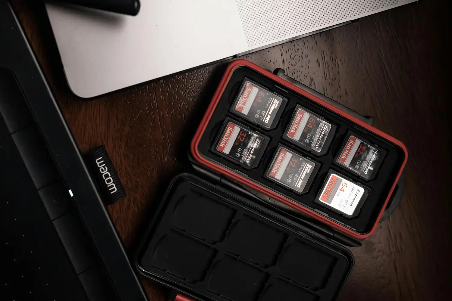 overhead of a memory card holder opened with 6 memory cards inside